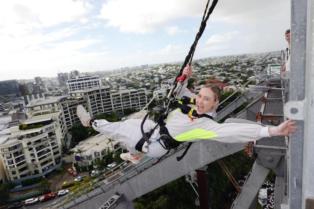 Woman does The Swing at Story Bridge Adventure Climb in Brisbane